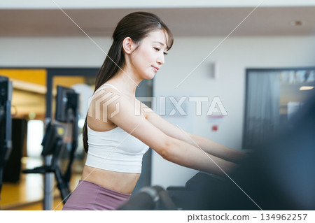 Young woman training in a sports gym Young woman training in a sports gym 134962257