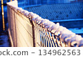 Snowy and frozen fence 134962563