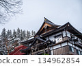 Snowy temple architecture and winter sky | Traditional Japanese roofs and quiet winter 134962854