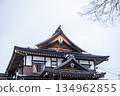 Snowy temple architecture and winter sky | Traditional Japanese roofs and quiet winter 134962855