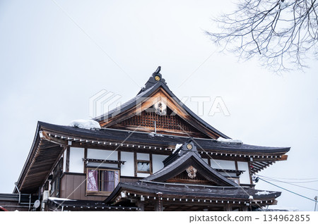 Snowy temple architecture and winter sky | Traditional Japanese roofs and quiet winter 134962855