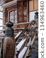 Snow-covered stairs and spires of the main temple hall | Wooden design details seen in Japanese architecture 134963460