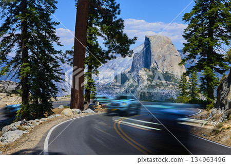 Glacier Point Road With Motion Blur Traffic and Iconic Half Dome Yosemite 134963496