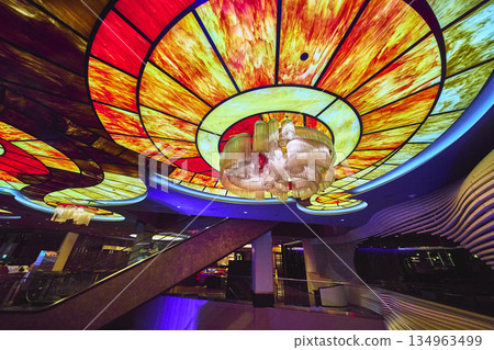 Vibrant Stained Glass Ceiling With Chandelier And Escalator In Las Vegas Casino 134963499