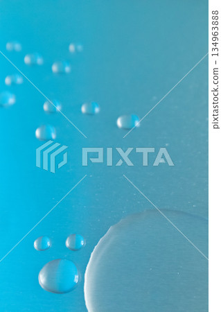 Gray and deep blue background with drops and puddles 134963888