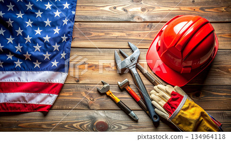 American Flag With Construction Tools, Hard Hat, And Gloves On Wooden Workbench. 134964118