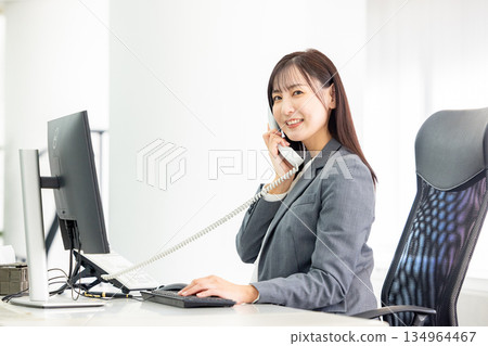 A woman making a phone call A woman making a phone call 134964467