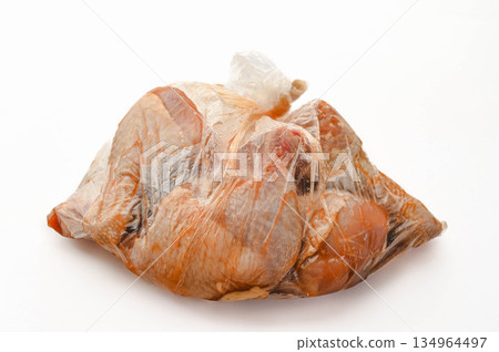 Bone-in chicken marinated in a plastic bag Bone-in chicken marinated in a plastic bag 134964497