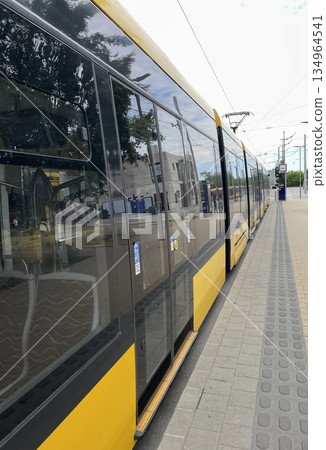 Close-Up of a Yellow and Black Modern Tram 134964541