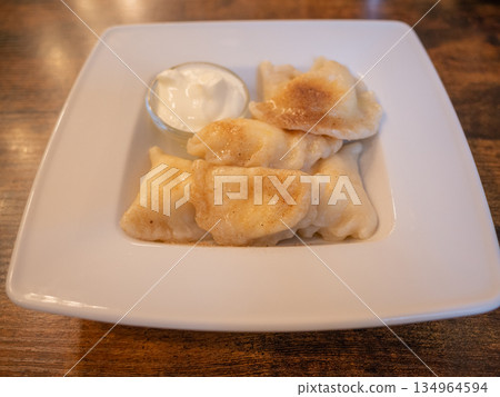 [Poland] Polish-style dumplings, pierogi, eaten at a restaurant in Krakow 134964594