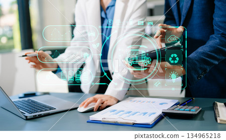ESG concept of environmental, Green ethical business preserving resources, reducing CO2, Business person team working on laptop virtual smartphone 134965218