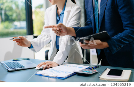 Team work process. Photo young business crew working with new startup project. Project managers meeting. Analyze plans, papers. Team work process. Photo young business crew working with new startup project. Project managers meeting. Analyze plans, papers. 134965219