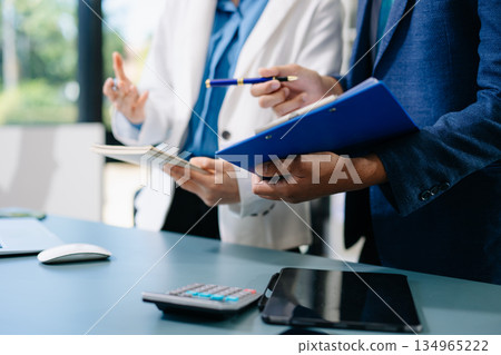 Business team meeting. professional investor working new start up project. Finance task. with smart phone and laptop and digital tablet computer 134965222