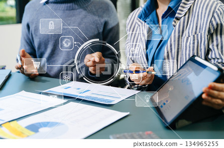 Working team meeting concept, business using laptop and smart phone and digital tablet computer with digital marketing media in virtual icon network diagram office Working team meeting concept, business using laptop and smart phone and digital tablet computer with digital marketing media in virtual icon network diagram office 134965255