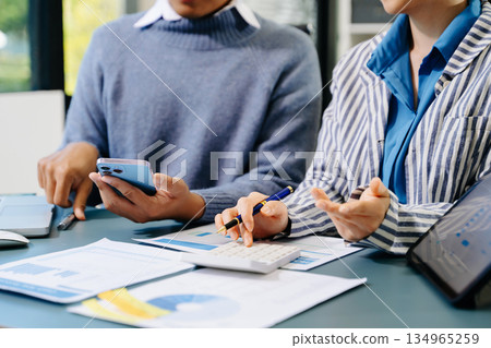 Businessman and team analyzing financial statement Finance task. with smart phone and laptop and tablet. Wealth management concept Businessman and team analyzing financial statement Finance task. with smart phone and laptop and tablet. Wealth management concept 134965259