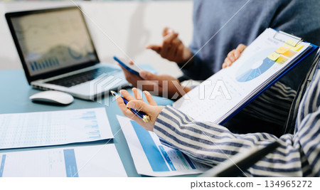 Businessman and team analyzing financial statement Finance task. with smart phone and laptop and tablet. Wealth management concept Businessman and team analyzing financial statement Finance task. with smart phone and laptop and tablet. Wealth management concept 134965272
