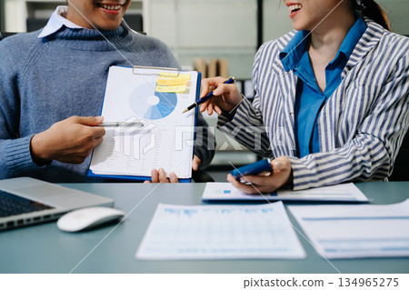 Businessman and team analyzing financial statement Finance task. with smart phone and laptop and tablet. Wealth management concept Businessman and team analyzing financial statement Finance task. with smart phone and laptop and tablet. Wealth management concept 134965275