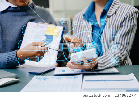 Business team working virtual modern smartphone to reduce CO2 emissions carbon footprint climate change to limit global warming.Sustainable development and green business concept. at office 134965277