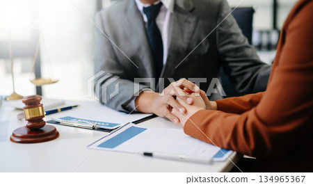 justice and law concept.Male judge in a courtroom on table and Counselor or Male lawyer working in office. Legal law, advice and justice concept. 134965367
