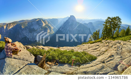 Panorama of Half Dome and Sunbeam from Glacier Point Yosemite with Hiker in California 134965786