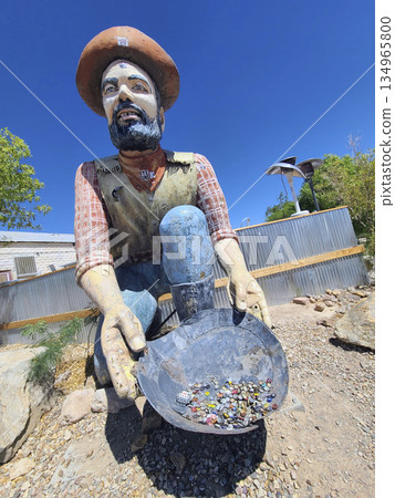 Prospector Statue With Pan Full Of Trinkets Roadside Attraction In Nevada Prospector Statue With Pan Full Of Trinkets Roadside Attraction In Nevada 134965800