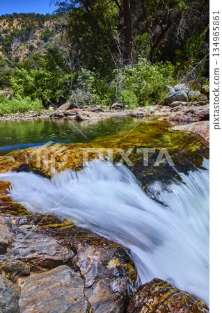 Vibrant River Flow Over Rocks and Forest Landscape in Sequoia National Park Vibrant River Flow Over Rocks and Forest Landscape in Sequoia National Park 134965861