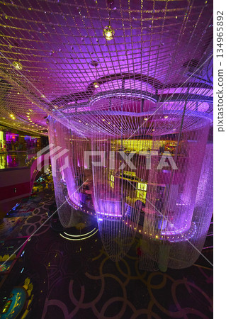 Luxury Crystal Chandelier Installation in Las Vegas Casino With Neon Lights 134965892