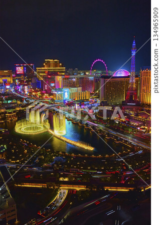 Aerial Las Vegas Strip Fountain Show Eiffel Tower and High Roller at Night Aerial Las Vegas Strip Fountain Show Eiffel Tower and High Roller at Night 134965909