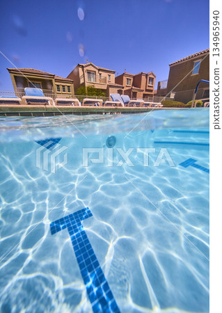 Underwater Pool View Suburban Neighborhood Homes and Lounge Chairs in Las Vegas Underwater Pool View Suburban Neighborhood Homes and Lounge Chairs in Las Vegas 134965940