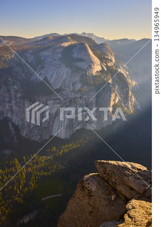 Sunrise Sunbeam Over Half Dome Granite Cliff and Pine Forest from Glacier Point 134965949