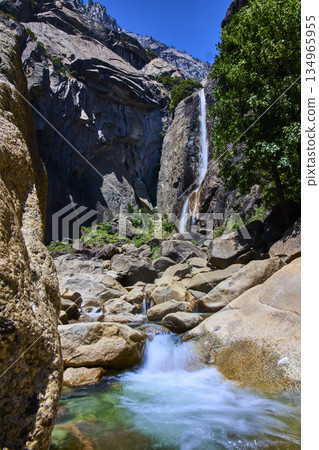 Lower Falls Trail Rushing Waterfall Granite Cliffs and Lush Greenery Yosemite Lower Falls Trail Rushing Waterfall Granite Cliffs and Lush Greenery Yosemite 134965955