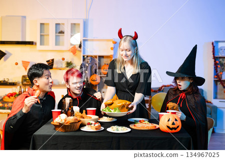 Joyful office Halloween party with coworkers in costumes, celebrating with drinks and laughter, fostering teamwork and festive spirit Joyful office Halloween party with coworkers in costumes, celebrating with drinks and laughter, fostering teamwork and festive spirit 134967025