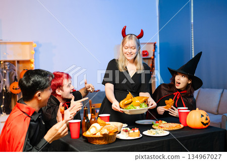 Joyful office Halloween party with coworkers in costumes, celebrating with drinks and laughter, fostering teamwork and festive spirit Joyful office Halloween party with coworkers in costumes, celebrating with drinks and laughter, fostering teamwork and festive spirit 134967027