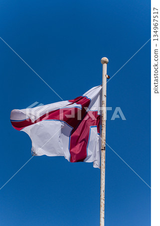 Georgian flag on the clear blue sky background 134967517