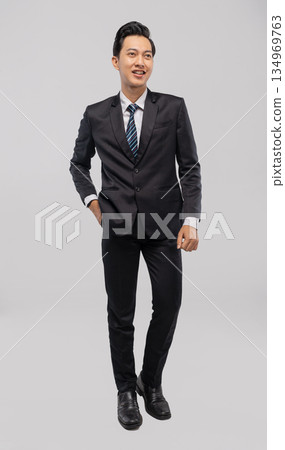 Professional Asian individual exuding friendliness and confidence Professional Asian individual exuding friendliness and confidence 134969763