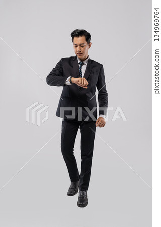 City executive walking confidently during daily commute 134969764
