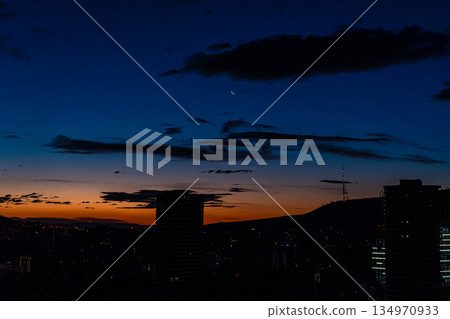 Dramatic sunrise over Tbilisi's downtown in the autumn season 134970933