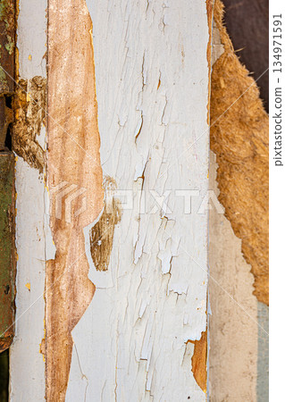 Peeling Cracked Paint on Weathered Wooden Surface 134971591