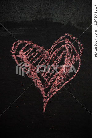 Chalk Heart Drawing on Dark Surface Represents Love for Valentine's Day 134972317