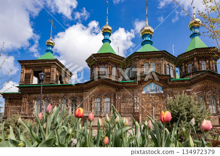 Wooden russian Orthodox church with golden dome. Religious architecture Wooden russian Orthodox church with golden dome. Religious architecture 134972379