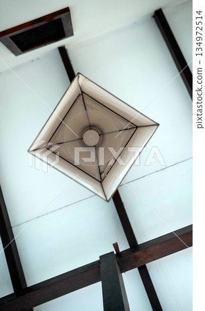 Chandelier with bulb Cozy low angle lighting view Chandelier with bulb Cozy low angle lighting view 134972514