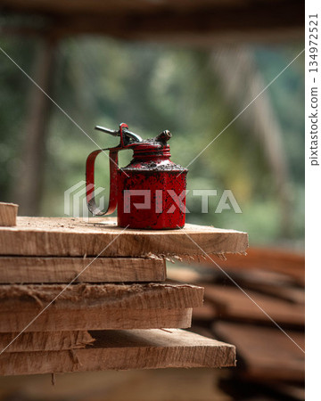 Oil Can Rusty On a Timber Plank Oil Can Rusty On a Timber Plank 134972521