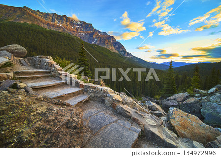 Stone Steps Forest Valley and Majestic Mountain at Sunrise in Golden Hour Stone Steps Forest Valley and Majestic Mountain at Sunrise in Golden Hour 134972996