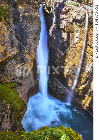 Waterfall Plunging Into Rocky Canyon With Lush Moss And Turquoise Pool Waterfall Plunging Into Rocky Canyon With Lush Moss And Turquoise Pool 134973052