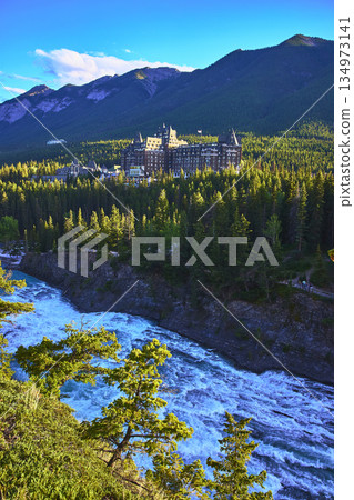 Banff Springs Hotel Castle Forest and River with Mountain Backdrop in Canada 134973141