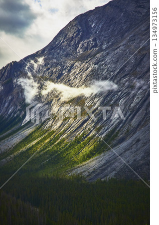 Mountain Cloud and Forest Layers in Dramatic Sunlight Jasper Canada 134973156