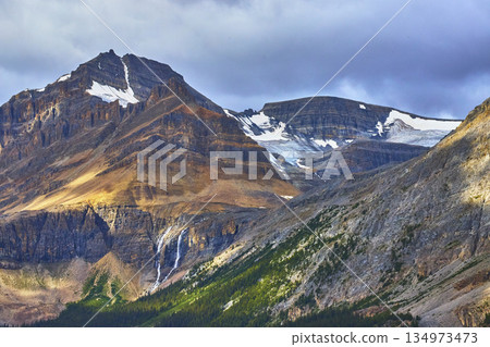 Rocky Mountain Peaks Glacier Waterfall and Forest in Canadian Wilderness Rocky Mountain Peaks Glacier Waterfall and Forest in Canadian Wilderness 134973473