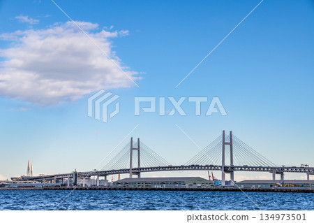 Yokohama Bay Bridge shining against the blue sky and sea Yokohama Bay Bridge shining against the blue sky and sea 134973501