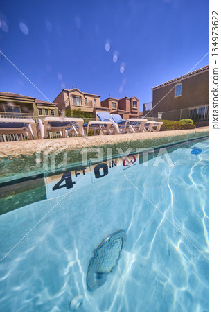 Underwater Pool and Suburban Neighborhood Homes with Sun Loungers in Las Vegas Underwater Pool and Suburban Neighborhood Homes with Sun Loungers in Las Vegas 134973622