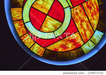 Stained Glass Ceiling Abstract Red and Yellow Pattern with Blue Glow Accent Stained Glass Ceiling Abstract Red and Yellow Pattern with Blue Glow Accent 134973732